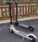 two EMOKO HT-H4 Pro Electric Scooter in black gray silver and white gleeride
